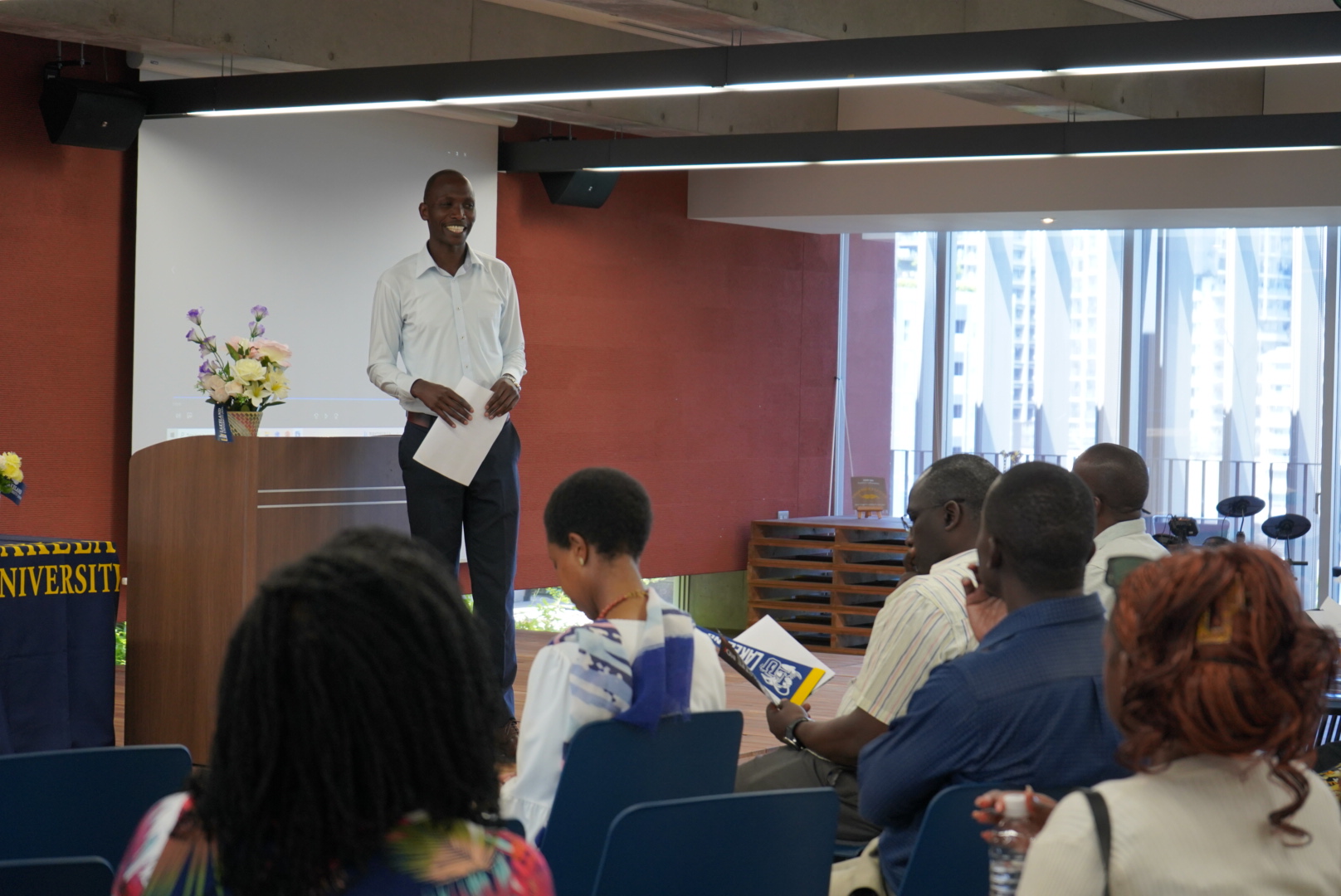Dr. Eliud Kiprop talks to students from Strathmore University at Lakeland University Japan.