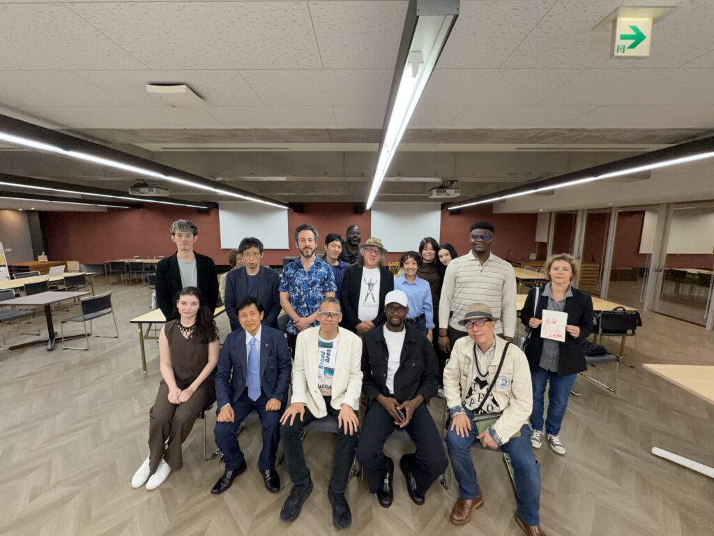 Mr. Keith Ochi sits with LUJ postgraduate students after completing his lecture on AI.